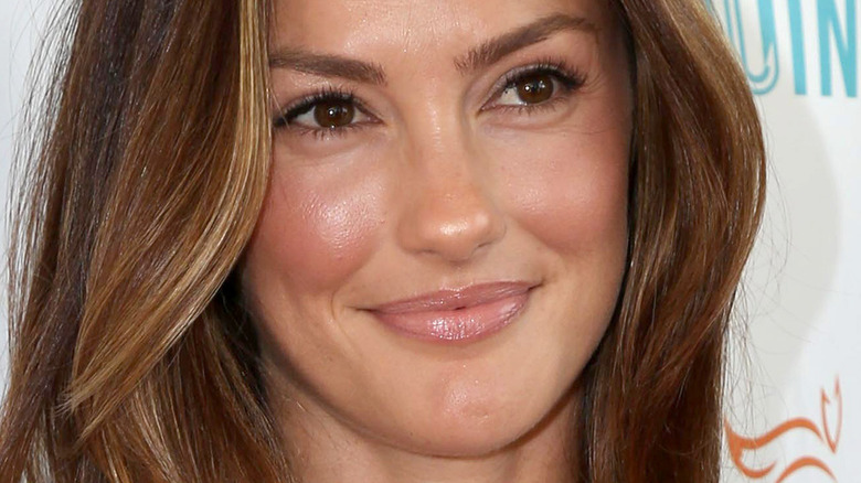 Minka Kelly smiles