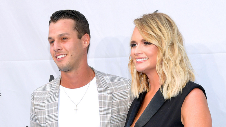 Miranda Lambert and Brendan McLoughlin looking away