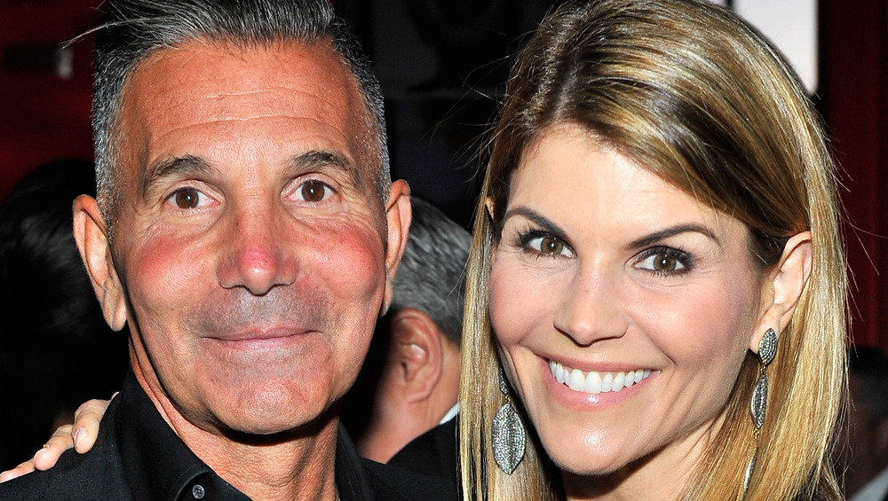 Mossimo Giannulli and Lori Loughlin smile together at event