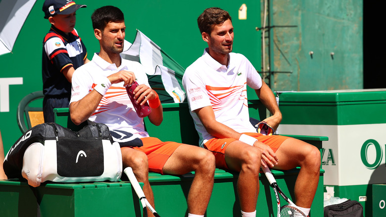 Novak and Marko Djokovic playing a doubles match