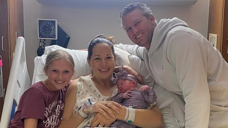 Cat Osterman smiling with her family