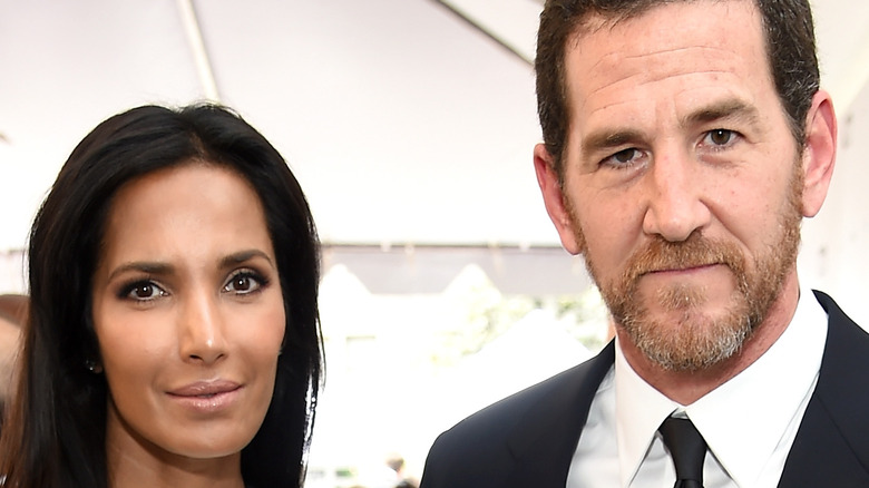 Padma Lakshmi and Adam Dell pose on the red carpet together