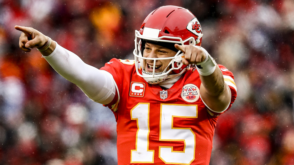 Patrick Mahomes smiling, pointing during game