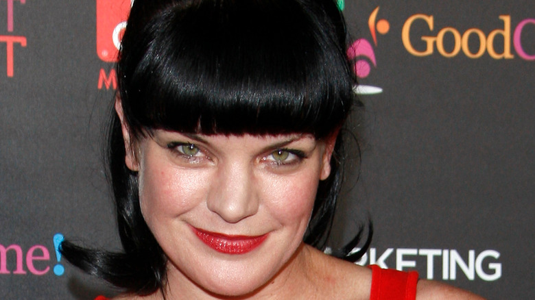 Pauley Perrette posing at event