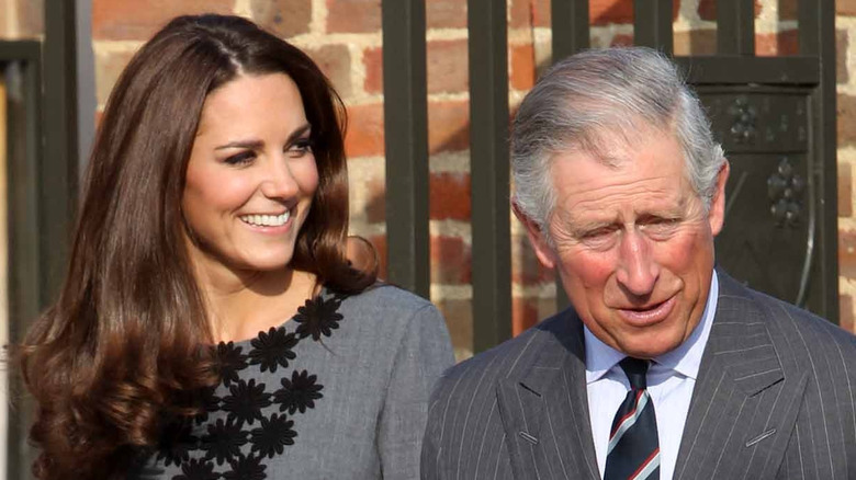 King Charles III and Kate Middleton during a royal appearance. 