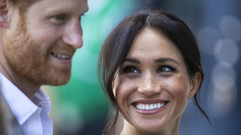 Meghan Markle looks lovingly at Prince Harry