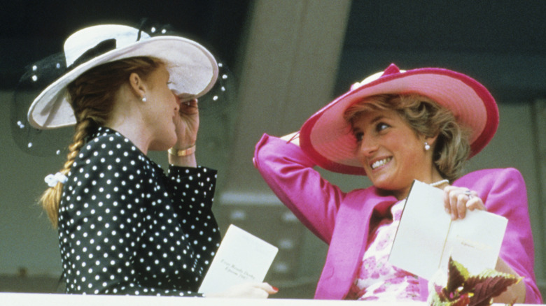 Sarah Ferguson and Princess Diana smiling at each other