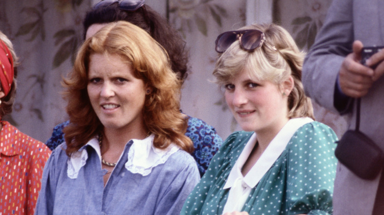 Sarah Ferguson and Princess Diana sitting next to each other at an event