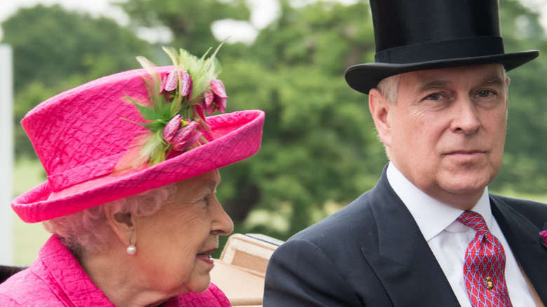 Queen Elizabeth in pink and Prince Andrew in top hat