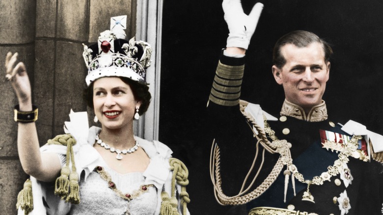 Queen Elizabeth and Prince Philip waving