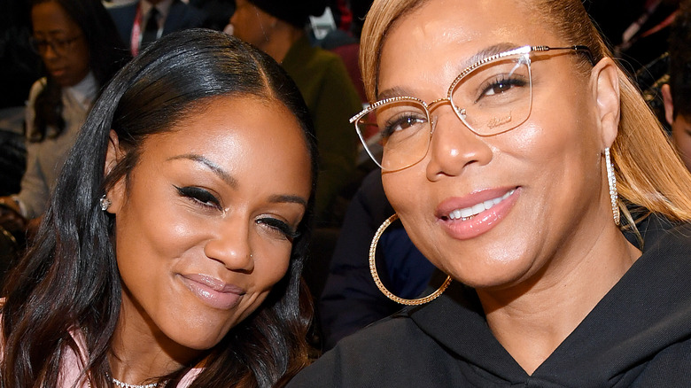 Queen Latifah and Eboni Nichols smile