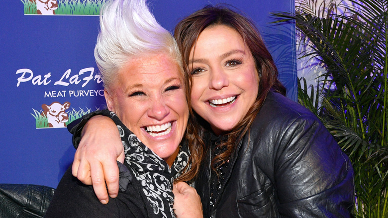 Rachael Ray arm around Anne Burrell both smiling