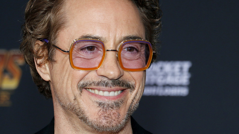 Robert Downey Jr. smiles at an event