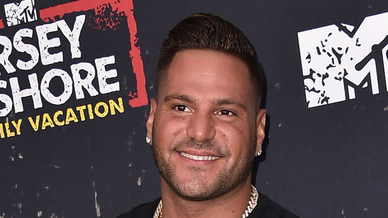 Ronnie Ortiz-Magro smiling with large chain and earrings