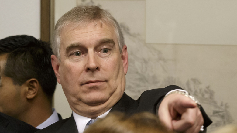 Prince Andrew points a finger