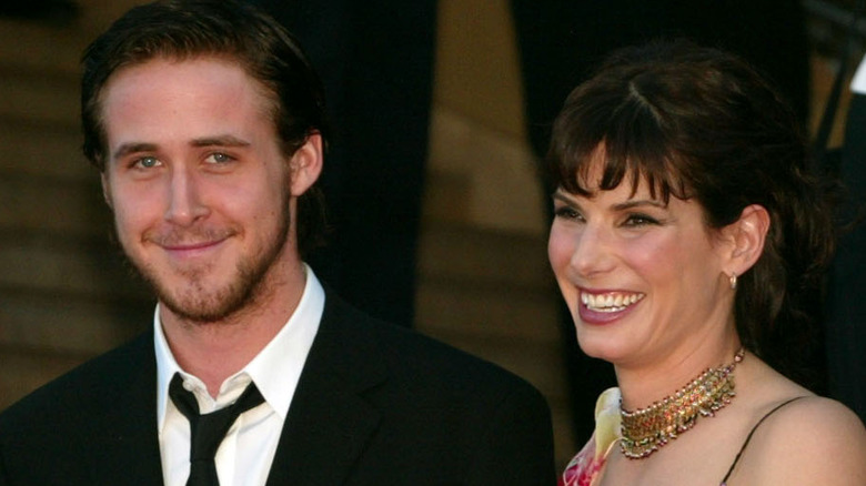 Ryan Gosling smiling with Sandra Bullock