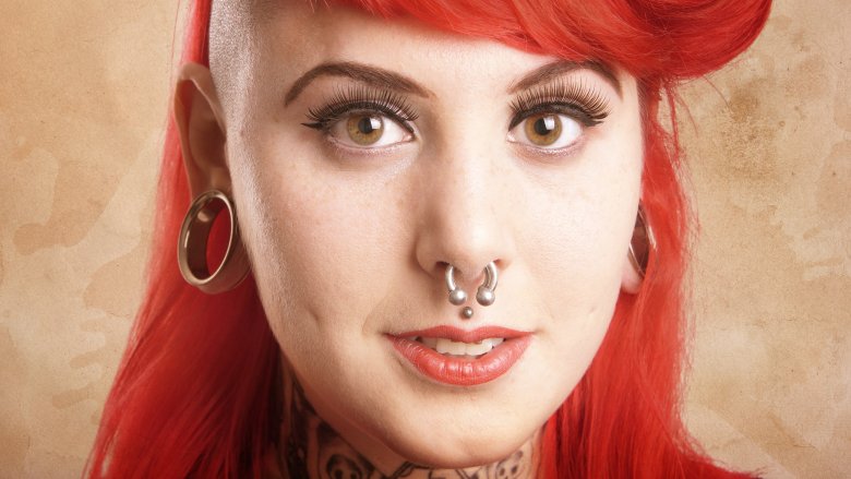 A redheaded woman with a septum ring