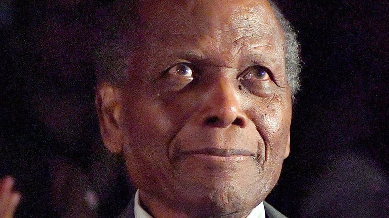 Sidney Poitier smiling at screening of film 