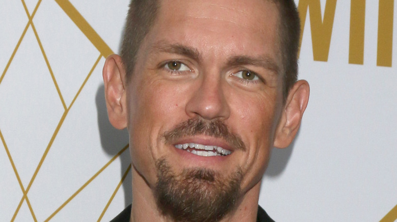 Steve Howey posing at event