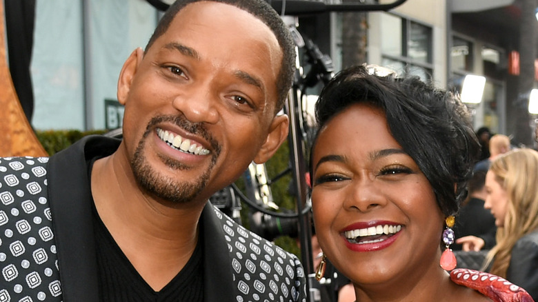 Will Smith and Tatyana Ali pose at the Aladdin premiere 