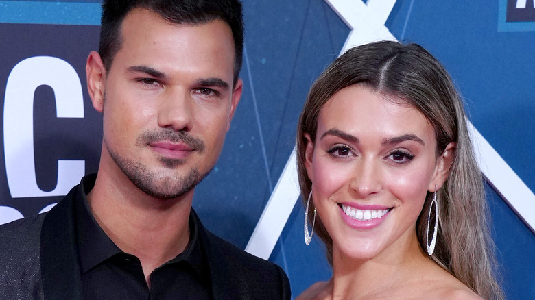 Taylor Lautner and Taylor Dome attend the 2022 CMT Music Awards at Nashville Municipal Auditorium on April 11, 2022 in Nashville, Tennessee. 