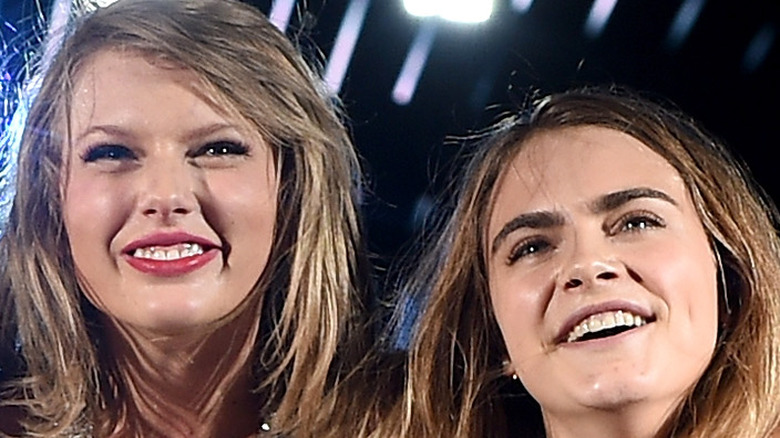 Taylor Swift and Cara Delevingne on stage
