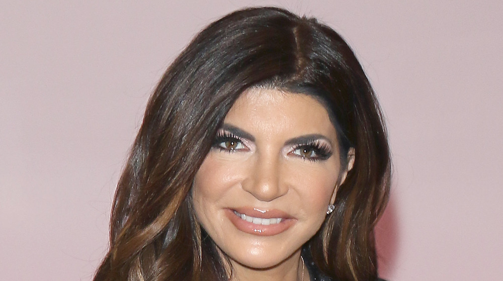 Close up of Teresa Giudice with light pink background 