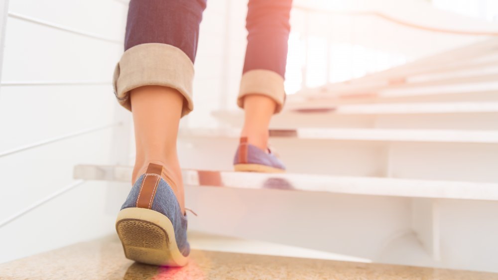 woman walking up stairs