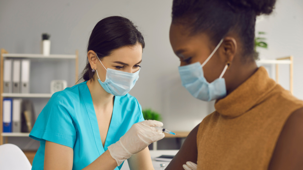 Woman getting vaccinated