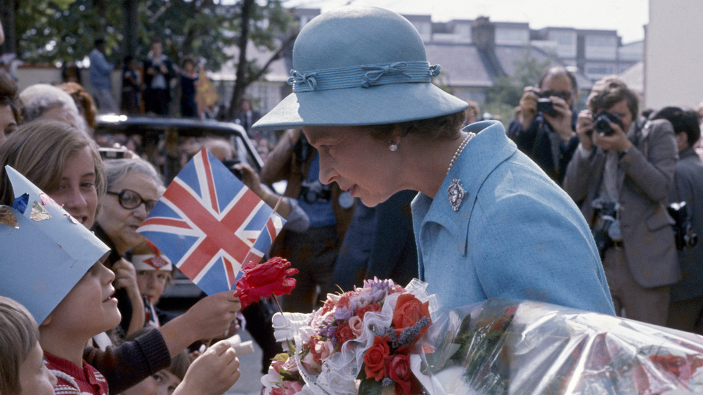 Queen Elizabeth II greeting fans