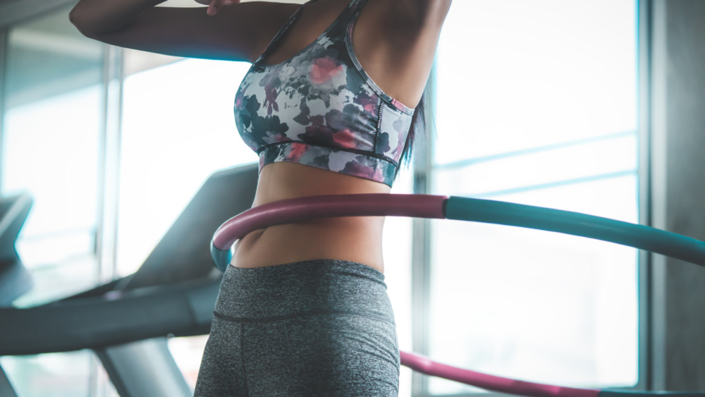 What is weighted hula hooping and why is it good for runners?