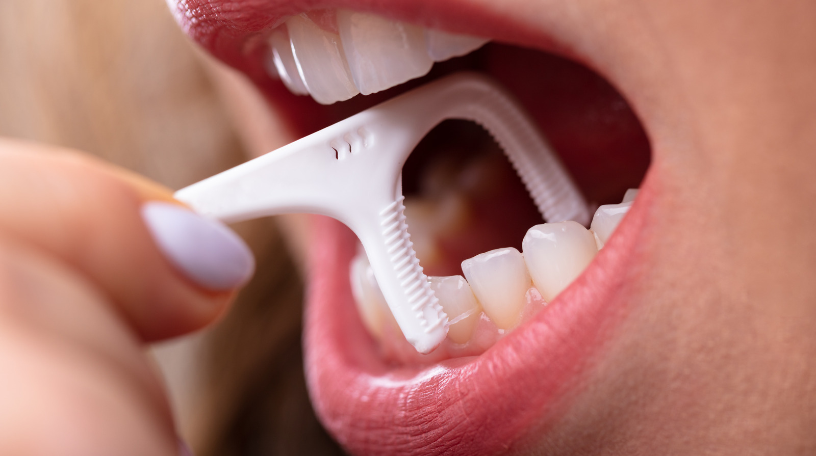The Truth About Those Floss Picks You Use To Clean Your Teeth And Gums