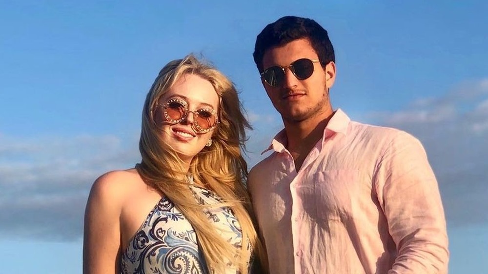 Tiffany Trump and her fiancé Michael Boulos pose together on the beach
