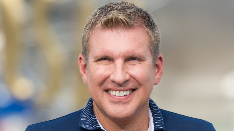 Todd Chrisley wearing blue, smiling