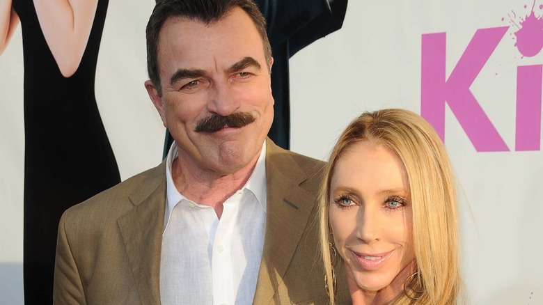 Tom Selleck and Jillie Mack attending an event