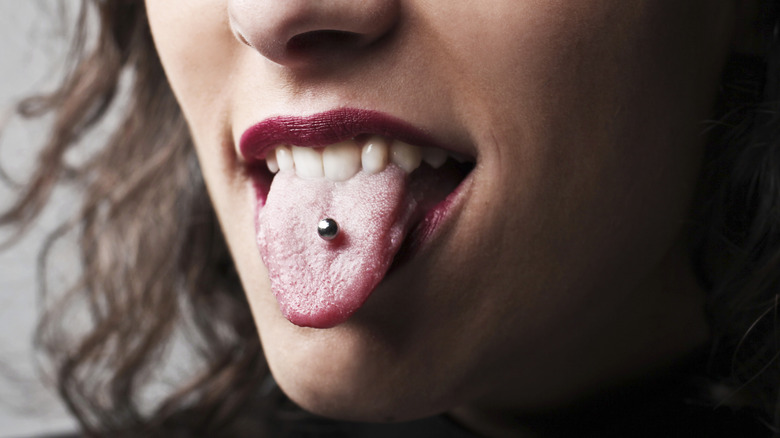 Woman with tongue piercing