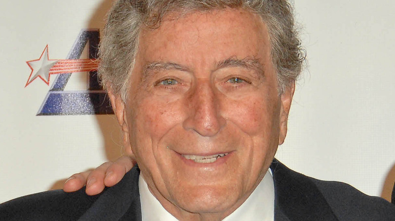 Tony Bennett smiling at red carpet event