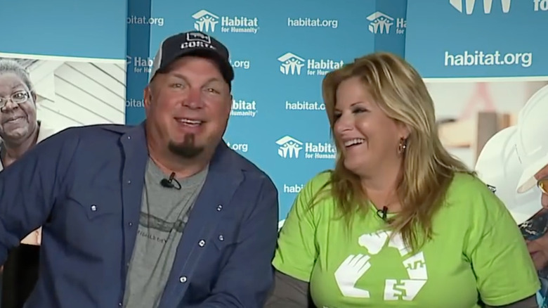 Trisha Yearwood and Garth Brooks giving an interview
