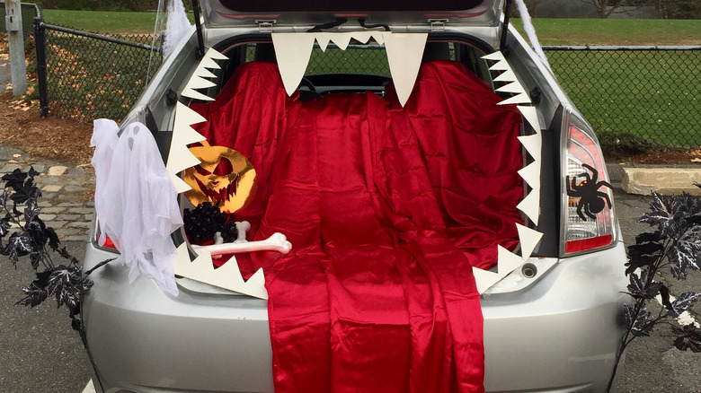 A car's trunk decorated for trunk-or-treat 