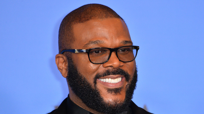 Tyler Perry smiles on the red carpet
