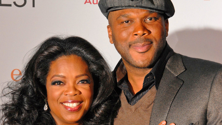 Tyler Perry and Oprah Winfrey pose together at an event