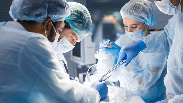 Doctors performing cosmetic surgery