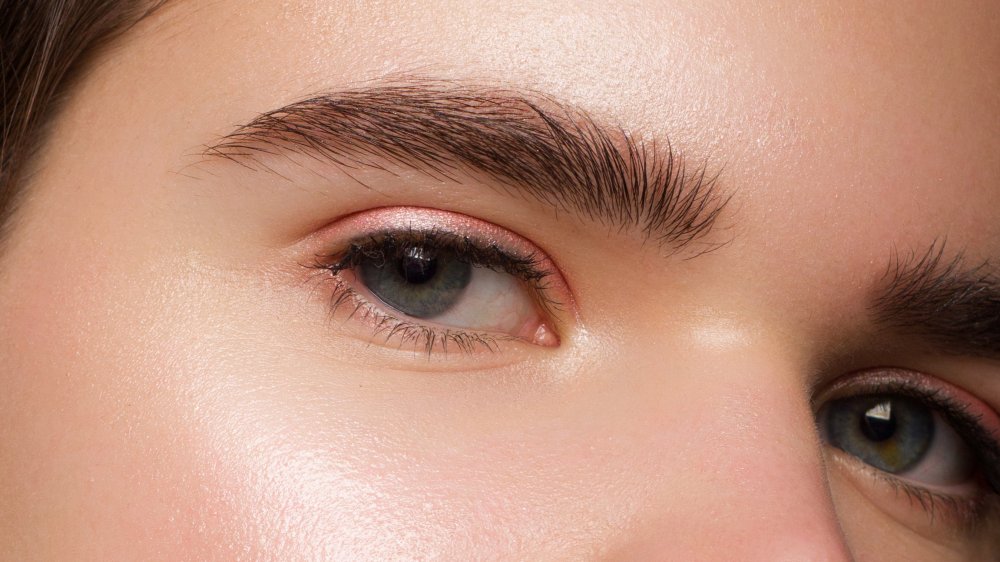 Close-up of thick eyebrows 