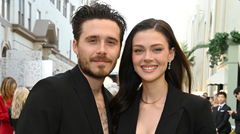 Brooklyn Beckham and Nicola Peltz smiling