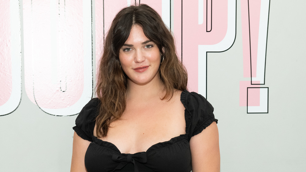 Victoria's Secret first plus-size model, Ali Tate-Cutler smiling in black top