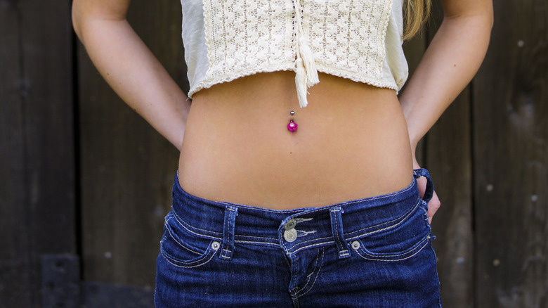 A woman wearing low-rise jeans 