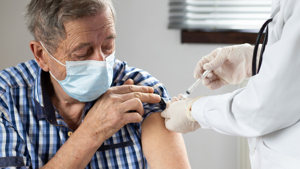 man getting COVID-19 vaccine