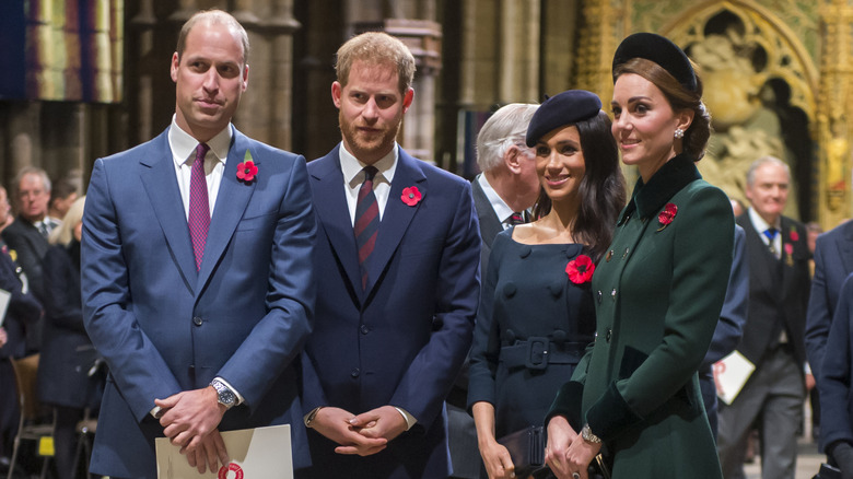 Prince William, Prince Harry, Meghan Markle, and Kate Middleton standing