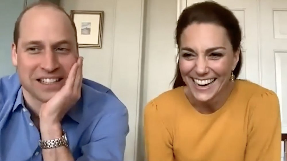 Prince William and Kate Middleton and boy wearing bunny ears