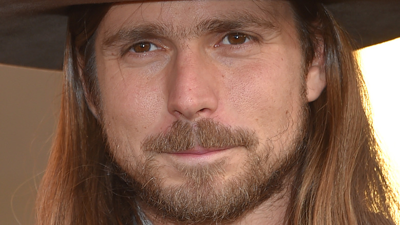 Lukas Nelson wearing hat